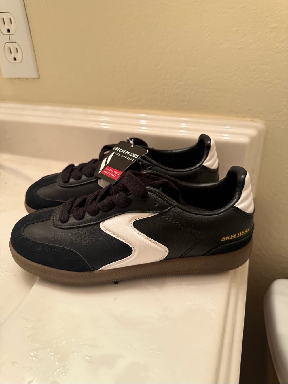 Skechers Black Sneakers with White Accent and Gum Sole